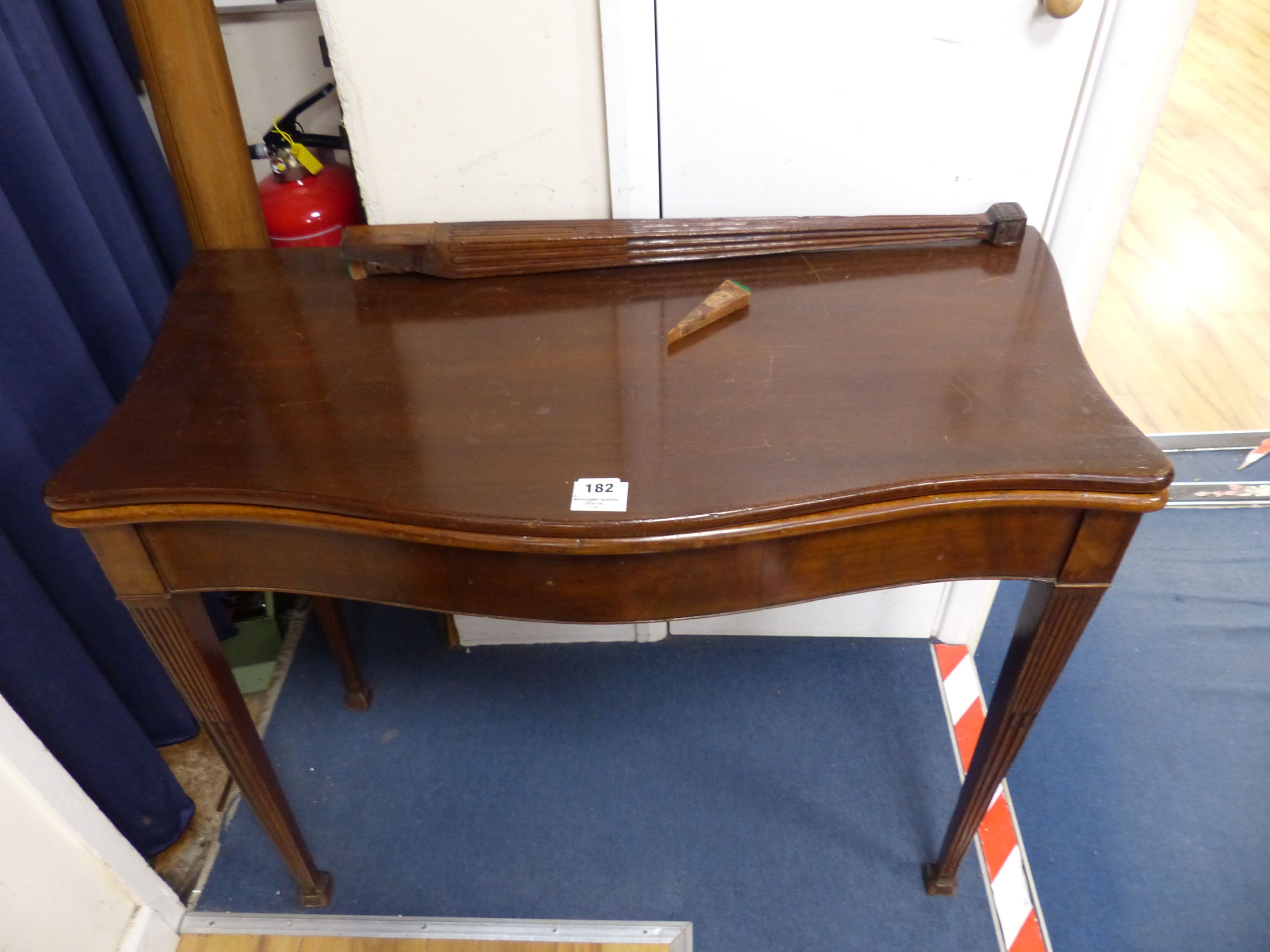 A George III style mahogany serpentine folding card table, width 87cm, depth 44cm, height 74cm